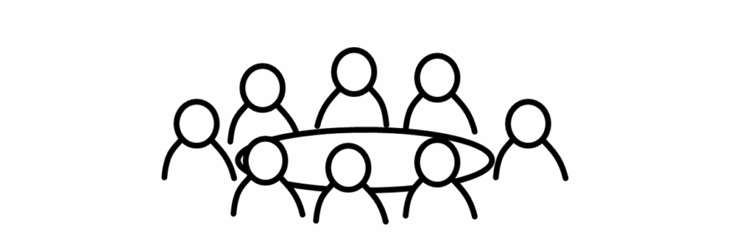 8 people gathered around a table representing a business meeting.