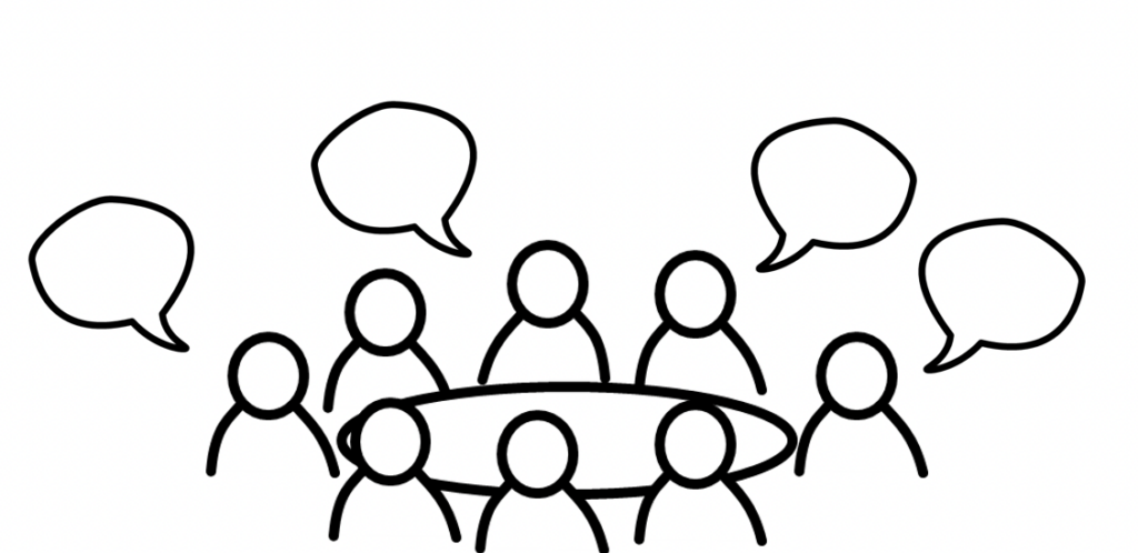 8 people gathered around a table representing a business meeting. The people are talking.